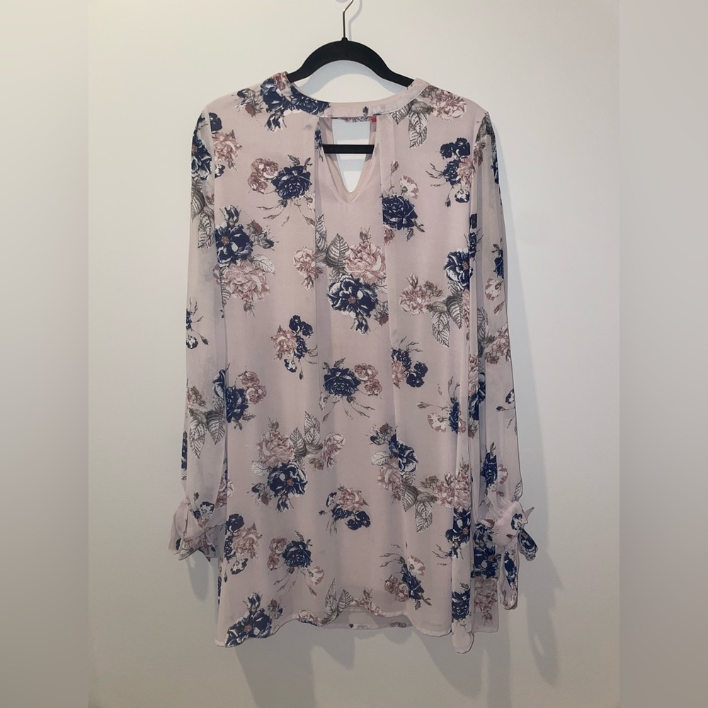 Long sleeve pale pink dress with blue flowers, and tie wrists